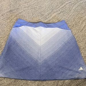 Golf skirt. Adidas. Attached shorts. Pockets. Excellent condition.Cotton.Size S